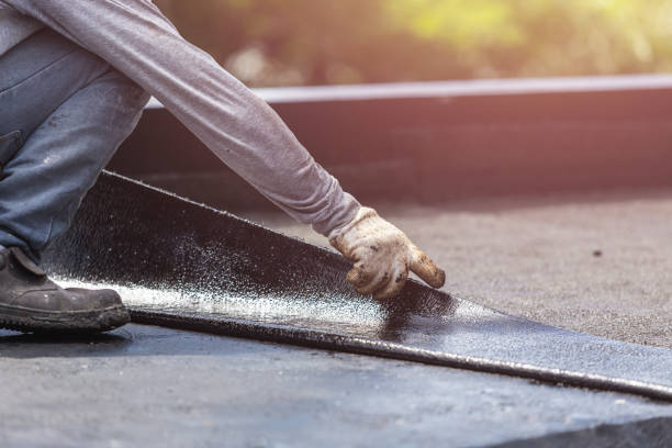Professional Basement Waterproofing technician working in Ashton, MD